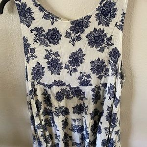 cream tiered blouse with blue floral design